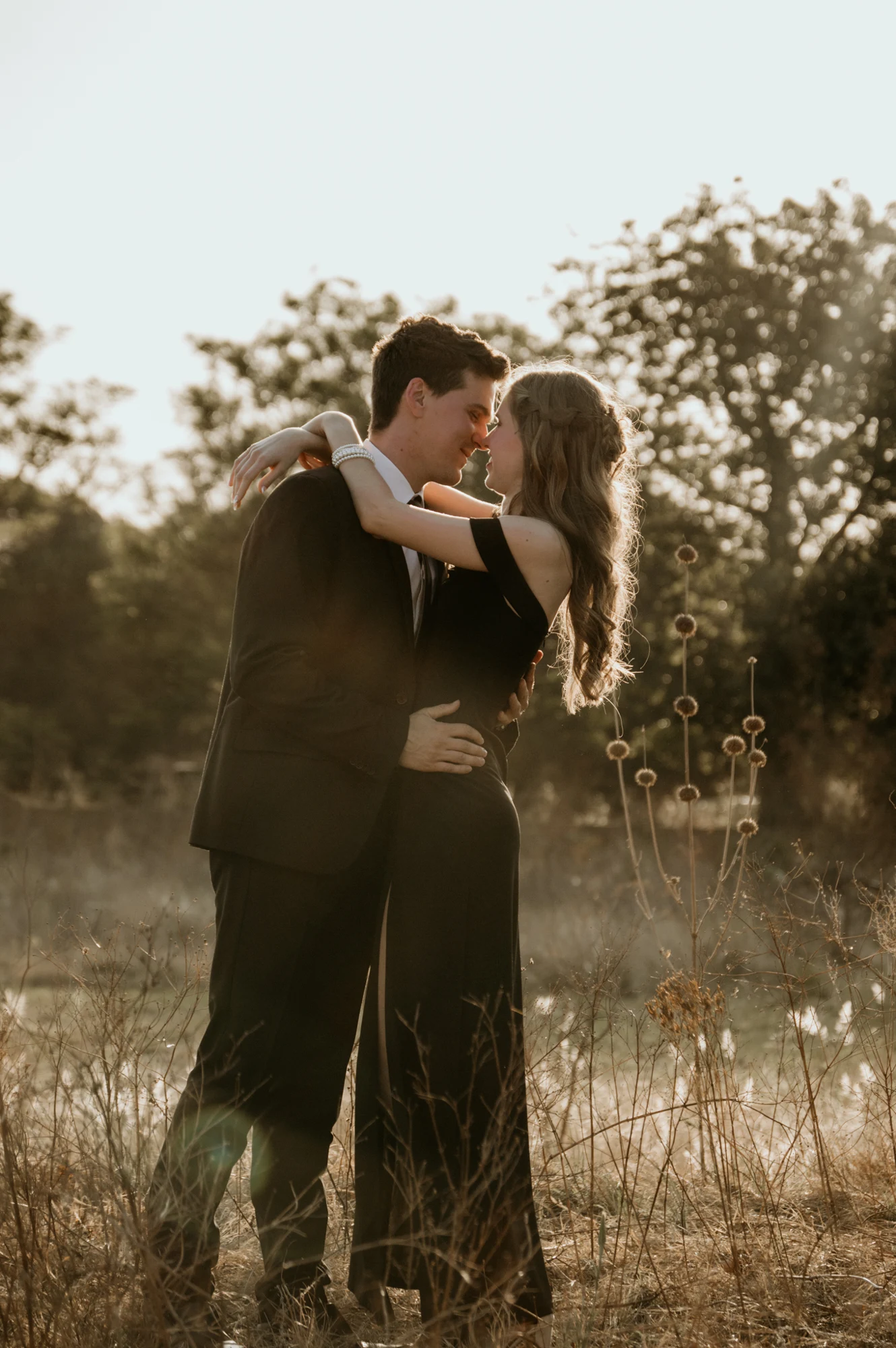 Ryan and Katryn kissing in warm evening light
